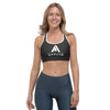 soutien gorge de sport noir NDA avec à l'avant la marque physique affûté de couleur blanc vue de face